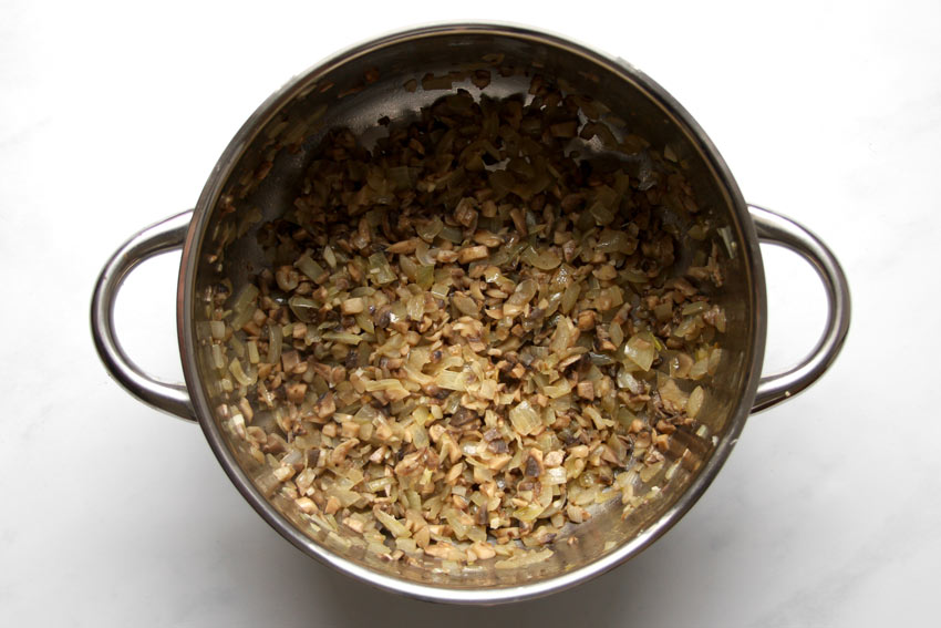 wilted mushrooms in saucepan