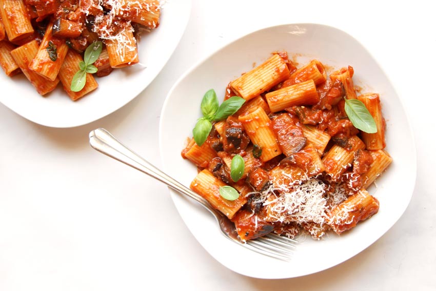 Pasta alla Norma with fresh basil and parmesan